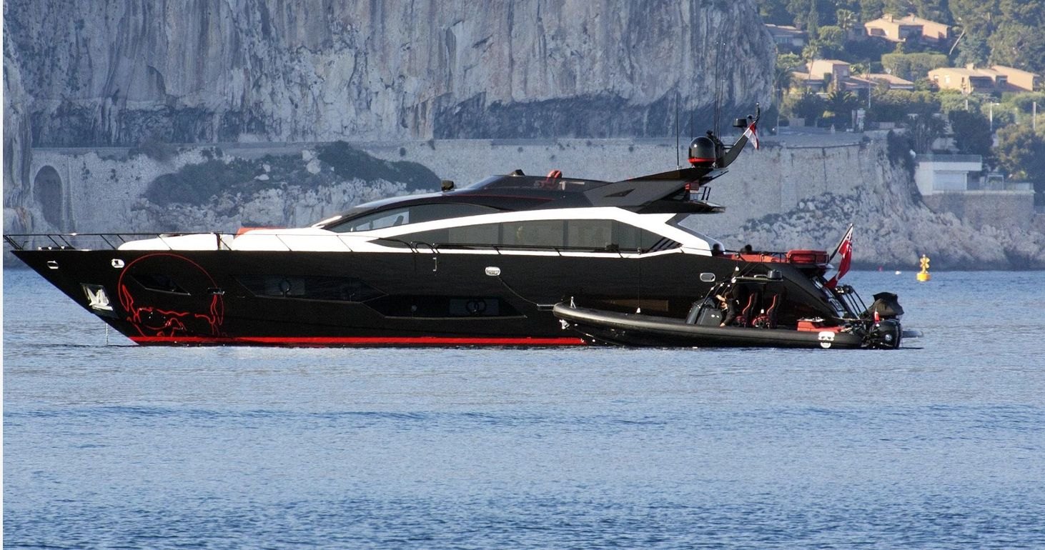 Black and red Sunseeker motor yacht Canelo in profile