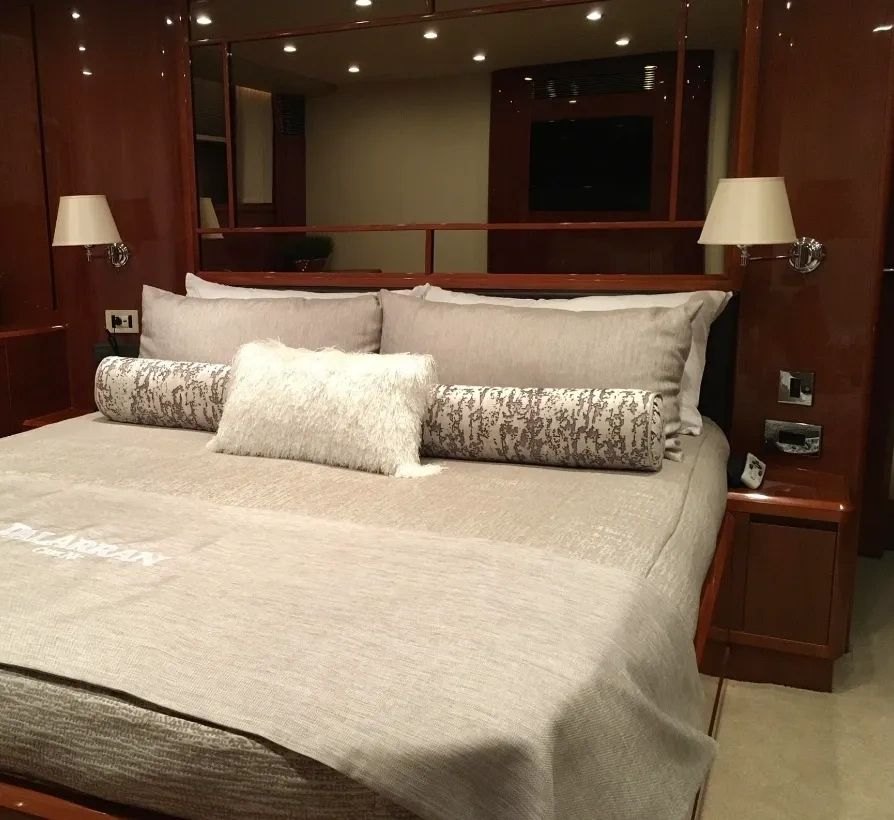 Custom Princess yacht bedding with tailored linens and bolsters